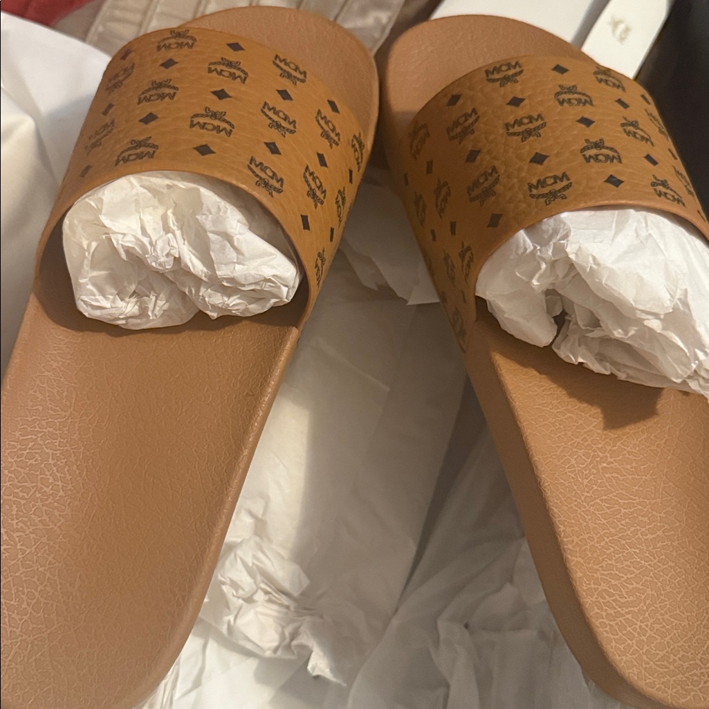 Mcm Brown Logo Slides